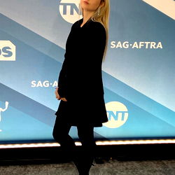 Onlyfans Model Ashley Black Standing at a Promotional Event