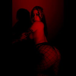 Playboyyy T - A Model Shoot with Red Lighting and a Sensual Pose