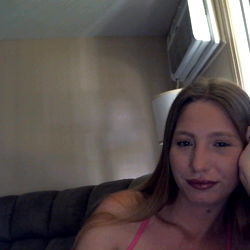 A Woman Posing for a Photo with Her Legs Crossed