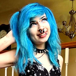 Stylish Individual with Blue Hair and Tattoo