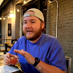 Wayne Clifton, A Man Enjoying a Drink in a Bar
