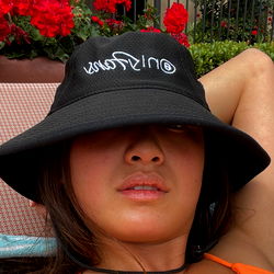 Woman in Bucket Hat Relaxing