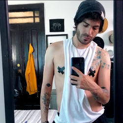 Óscar Isaac Ramírez Perales, A Young Tattooed Man Taking a Selfie in His Bedroom