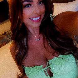 Stunning OnlyFans Model Smiling in Low-Cut Tank Top