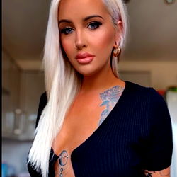 April - A Model Showcasing Her Ink and Style