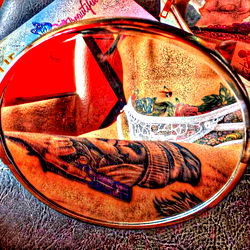 Karo Model Shows Off Tattoos on Magnified Mirror