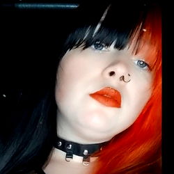 OnlyFans Model Anna Wilson with Red Hair and Earrings