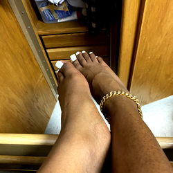 A cozy kitchen scene with a model's foot