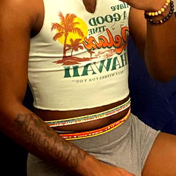 Fashionable model Nas✨ poses in a Hawaiian shirt and denim shorts