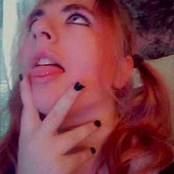 Vibrant and youthful OnlyFans model captivating viewers with sultry gaze