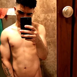 Shirtless Model Posing in Bathroom Mirror