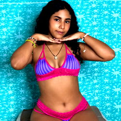 Stylish Andrea Gonzalez in Vibrant Bikini on White Background