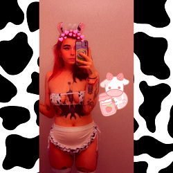 Model pose in lingerie with cow print theme