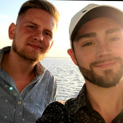 Aaron and friend at a scenic location,