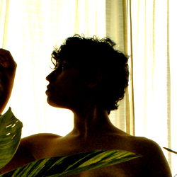 A captivating photograph of a model named Lazu, bathed in natural light.