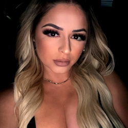 Victoria Ann, a Stunning Model Posing in Front of a Car