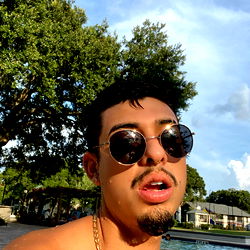 Adrian, a charming young man in a poolside setting
