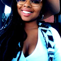 Tea, model in a car, with sunglasses and hat, from Bible Belt, against a neutral background