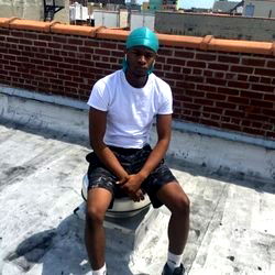 Athlete posing confidently on rooftop