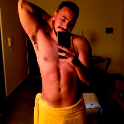 Shirtless Man with Muscles in Yellow Towel, Taking Selfie