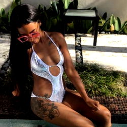 Onlyfans model Kamara in a luxurious outdoor setting