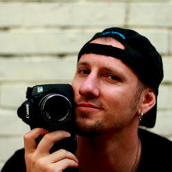 Paul Lynx - An OnlyFans Model Posing with a Camera