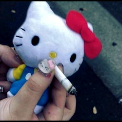 Hand holding a Hello Kitty cigarette lighter