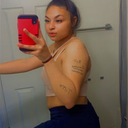 Stylish OnlyFans Model Kay in Casual Outfit, Awaiting a Drink