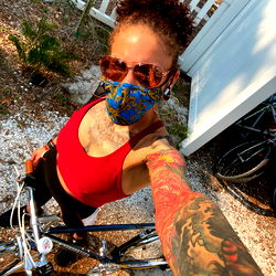 Vivid Street Scene with Tattooed Woman and Bike