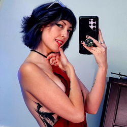 Beautiful Model Ocea, showcasing her tattooed back and striking pose, from OnlyFans