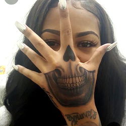 Edgy Skull Tattoo on Hand