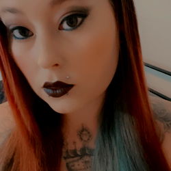 Onlyfans model AJ with a dark background