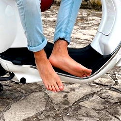 Feet Resting on a Scooter Seat
