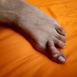 Feet in Socks on Orange Background
