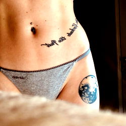 Stylish Tattoos and a Cosmic Moon Piece on the Belly