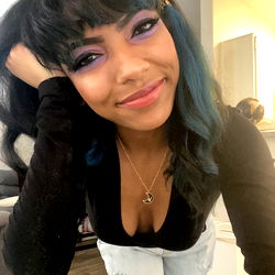 Casually Styled Individual with Colorful Hair and Makeup