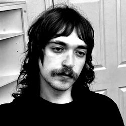 Young Adult Male, Long Hair, Tattoo