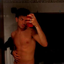 Shirtless Man Taking Selfie in Bathroom