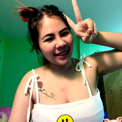 Onlyfans Model Plakem Makes a Peace Sign