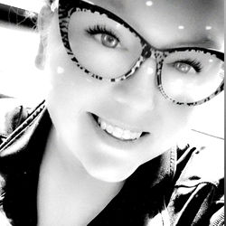 Archerychick21 - A Young Woman with Glasses and a Jacket, Posing for the Camera