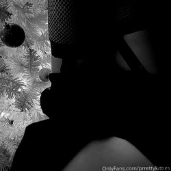 A cozy Christmas scene with Prretty Kitties and a microphone