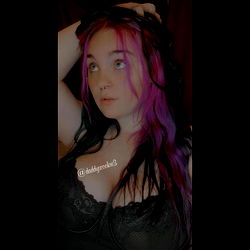 A Woman with Purple Hair and Makeup