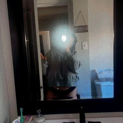 A person standing in front of a mirror in a bathroom, 💋 model photo from Dayton OH