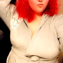 Melody Collingwood in a Red Velvet Dress