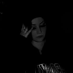 Woman in Sweatshirt with Hood, Seemingly Unhappy