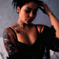 OnlyFans Model Astawaa with Tattoos and Black Lace