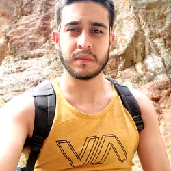 Adventurous Outdoorsman in Yellow V-Neck Tank Top