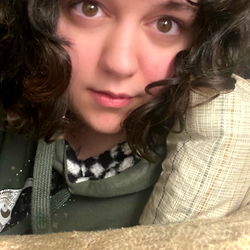 Woman laying down with curly hair