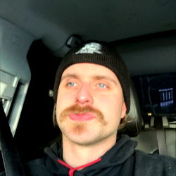 Male Uber Driver with Mustache in Vehicle