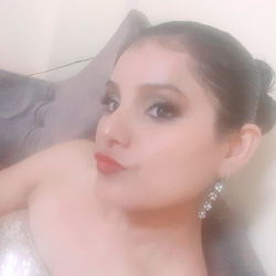 Vogue-inspired fashion model capturing a casual pose in her home